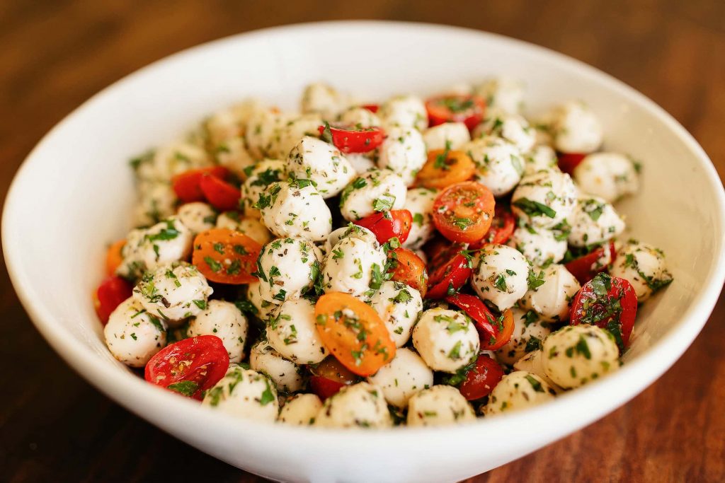 APM Tomato Basil Mozzarella Salad. Made fresh by our chefs!